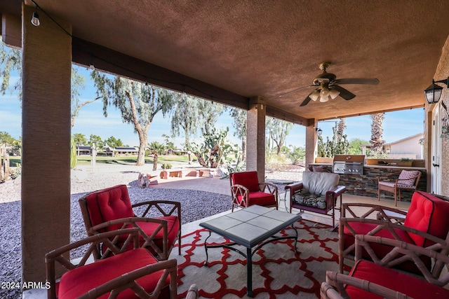 view of patio with exterior kitchen, grilling area, and ceiling fan