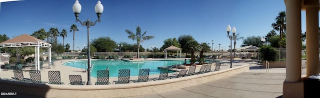 view of swimming pool with a gazebo and a patio