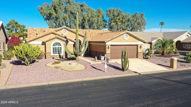 ranch-style house featuring a garage