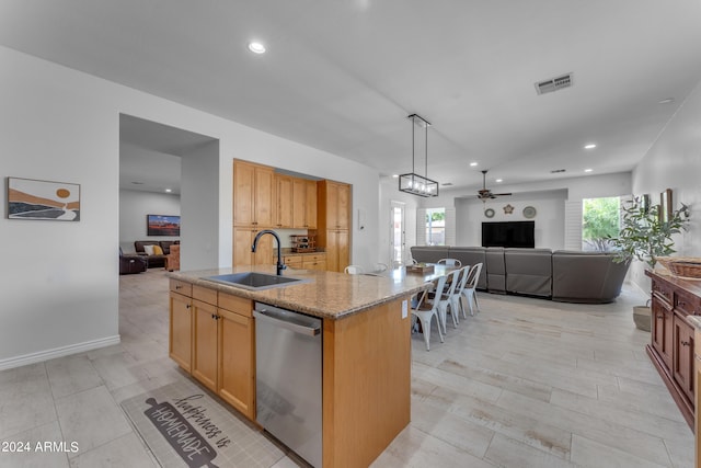 kitchen featuring an island with sink, a wealth of natural light, sink, and stainless steel dishwasher