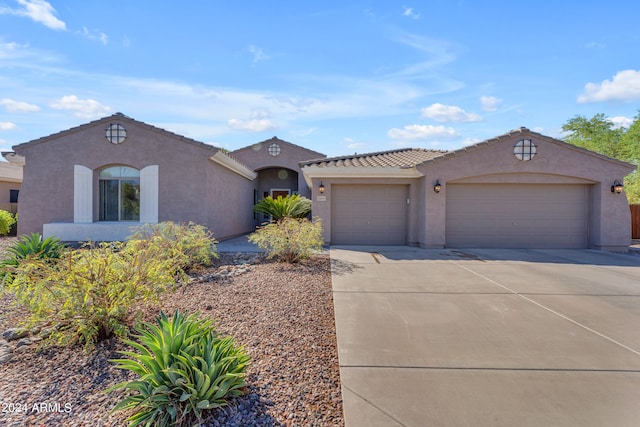 view of front of property with a garage