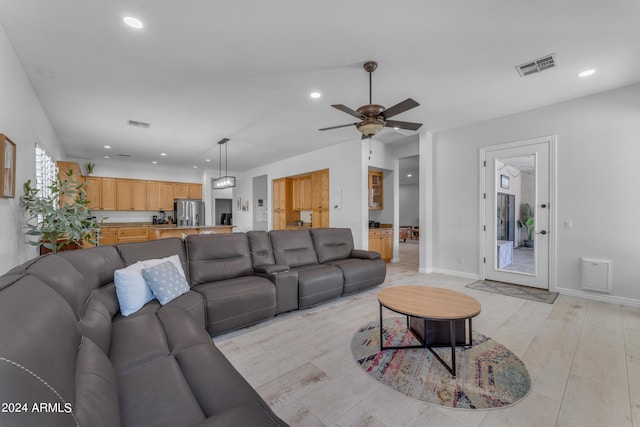 living room featuring ceiling fan