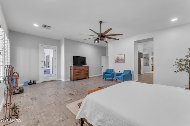 bedroom with light hardwood / wood-style floors and ceiling fan