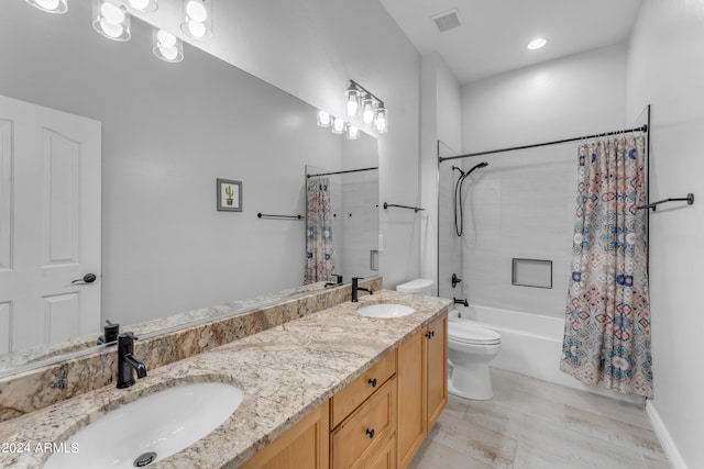 full bathroom featuring shower / bath combo, hardwood / wood-style floors, vanity, and toilet