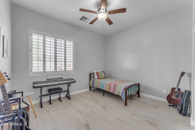 bedroom featuring light hardwood / wood-style flooring and ceiling fan