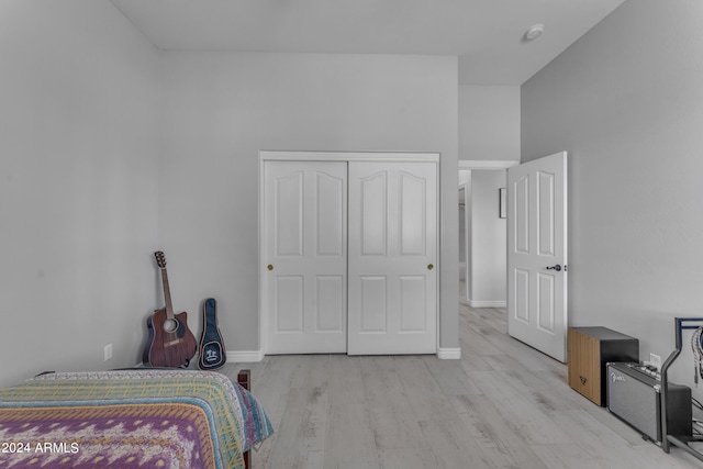 bedroom featuring light hardwood / wood-style floors and a closet