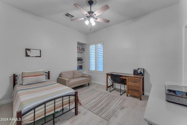 bedroom with ceiling fan and light hardwood / wood-style floors