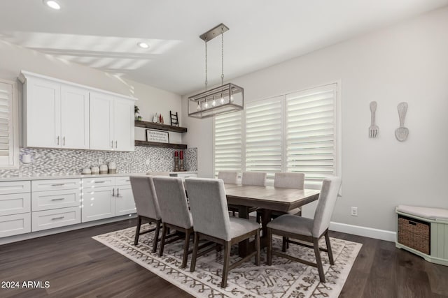 dining space with dark hardwood / wood-style floors