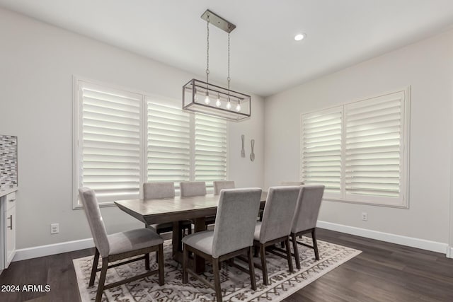 dining space with dark wood-type flooring