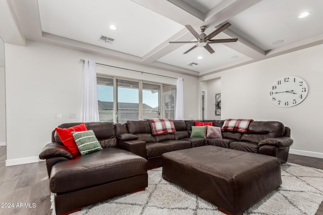 living room with beam ceiling, ceiling fan, coffered ceiling, and hardwood / wood-style flooring