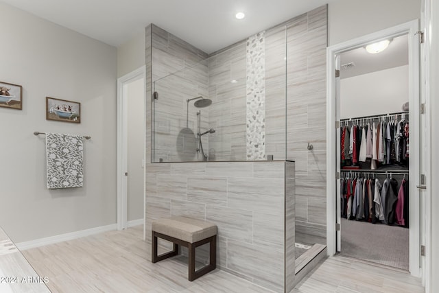 bathroom featuring tiled shower