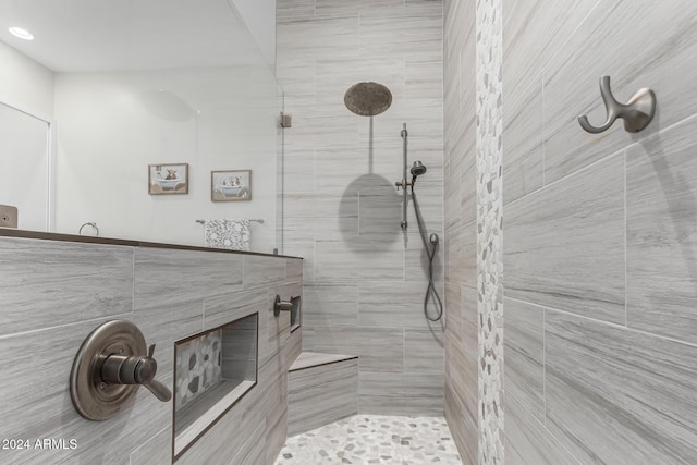 bathroom with a tile shower