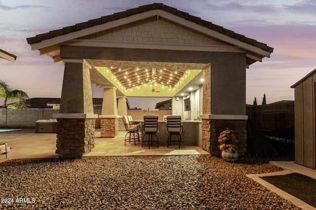 patio terrace at dusk with a bar