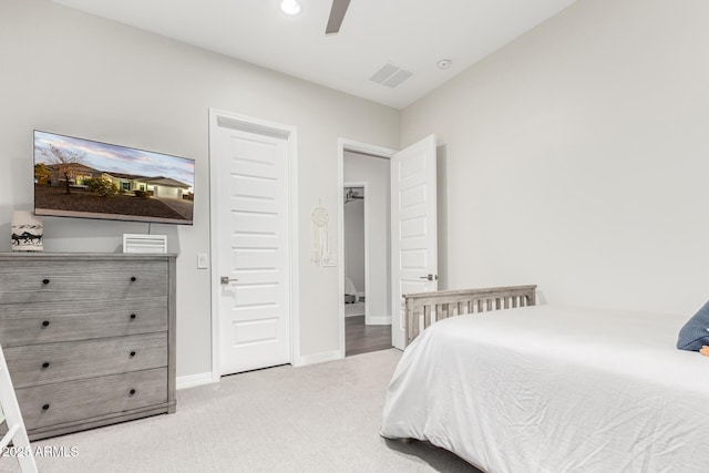 bedroom featuring ceiling fan and light colored carpet