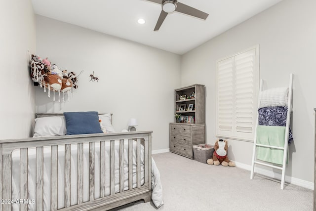 bedroom featuring ceiling fan and light colored carpet