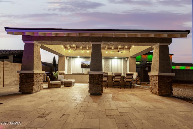 view of patio terrace at dusk