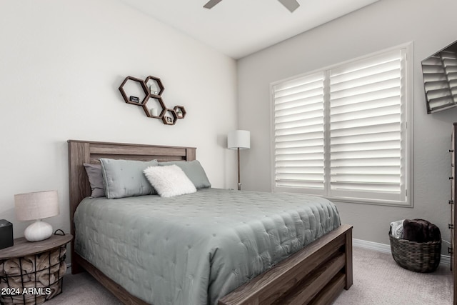 bedroom with light colored carpet and ceiling fan