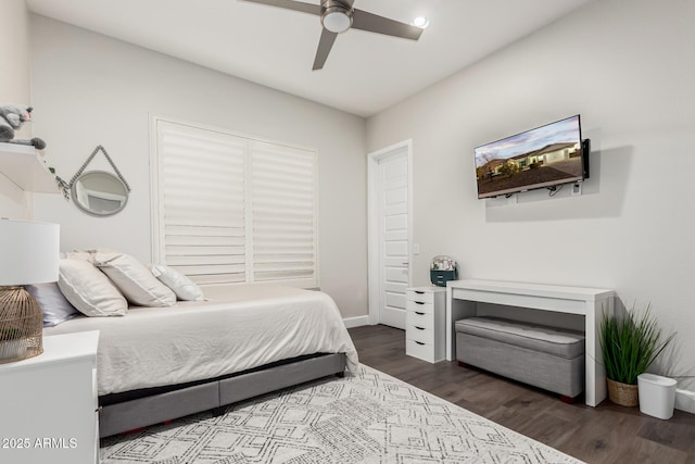 bedroom featuring ceiling fan and dark wood-type flooring