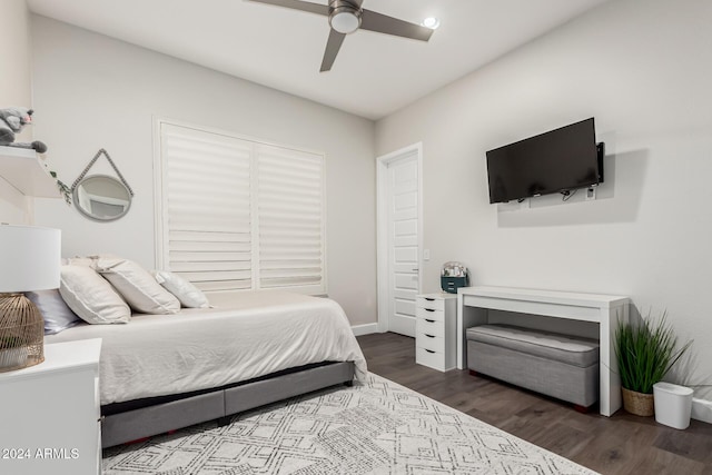 bedroom featuring ceiling fan and dark hardwood / wood-style flooring