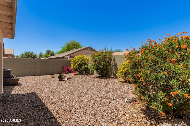4262 E Sundance Ave, Gilbert, AZ 85297 - view of yard featuring a fenced backyard and central AC unit