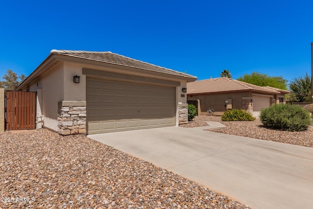 4262 E Sundance Ave, Gilbert, AZ 85297 - ranch-style house with an attached garage, driveway, stone siding, and stucco siding