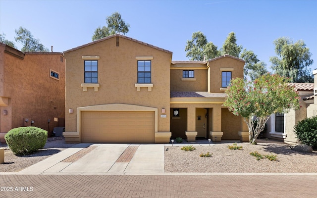 3025 E Fremont Rd, Phoenix, AZ 85042 - view of front of house with driveway, stucco siding, and a garage