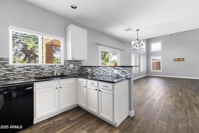 3025 E Fremont Rd, Phoenix, AZ 85042 - kitchen featuring black dishwasher, dark countertops, a peninsula, a chandelier, and dark wood-style floors
