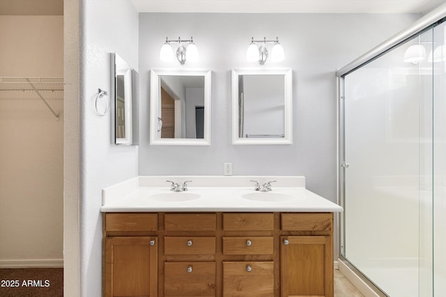 3025 E Fremont Rd, Phoenix, AZ 85042 - bathroom with a stall shower, double vanity, and a walk in closet