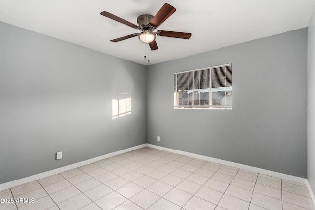 tiled spare room featuring ceiling fan