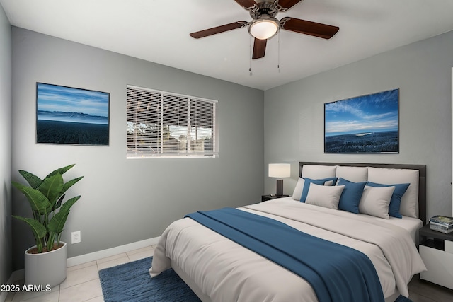 tiled bedroom featuring ceiling fan