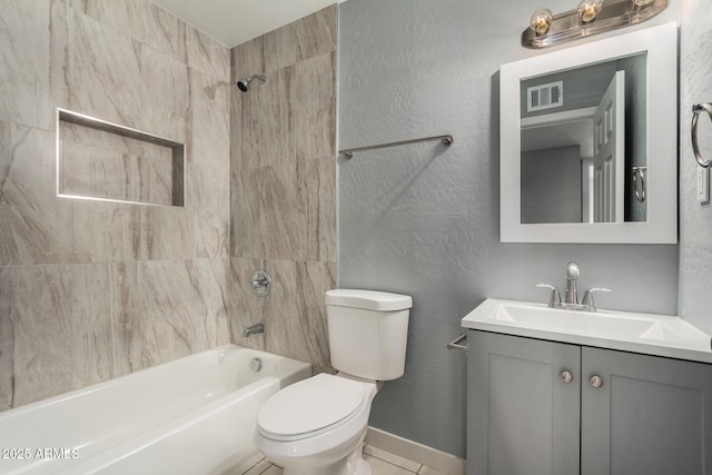 full bathroom with vanity, tiled shower / bath combo, and toilet