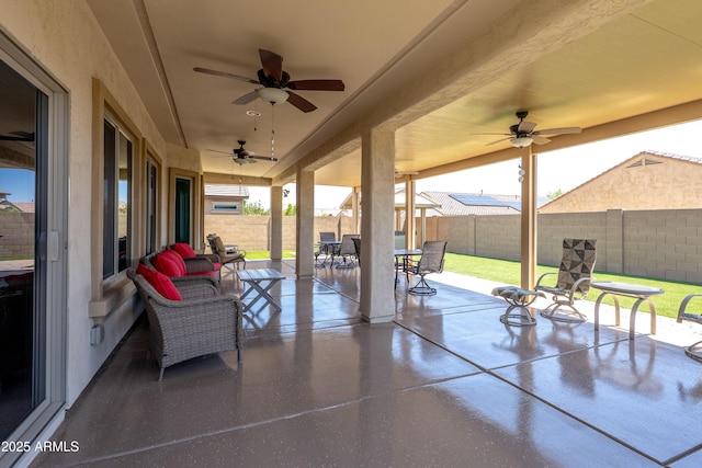 17547 W Gambit Trl, Surprise, AZ 85387 - fenced backyard with ceiling fan, a patio, and outdoor dining area
