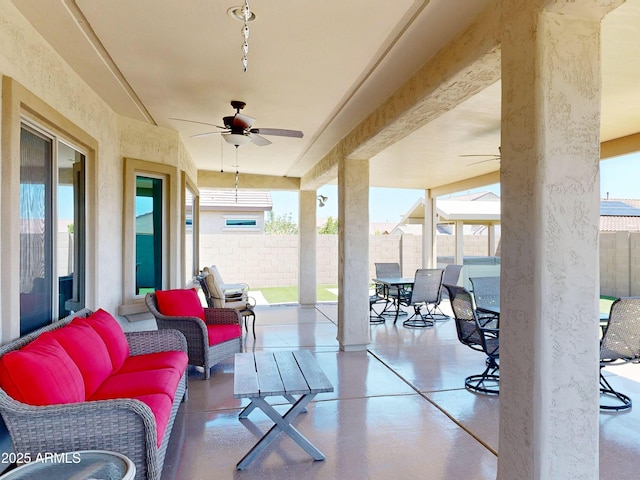 17547 W Gambit Trl, Surprise, AZ 85387 - fenced backyard featuring a ceiling fan, outdoor dining space, a patio, and an outdoor hangout area