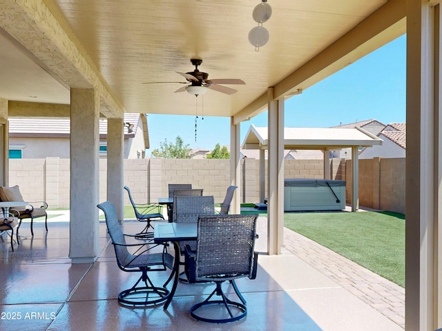 17547 W Gambit Trl, Surprise, AZ 85387 - fenced backyard with ceiling fan, a patio area, and outdoor dining area