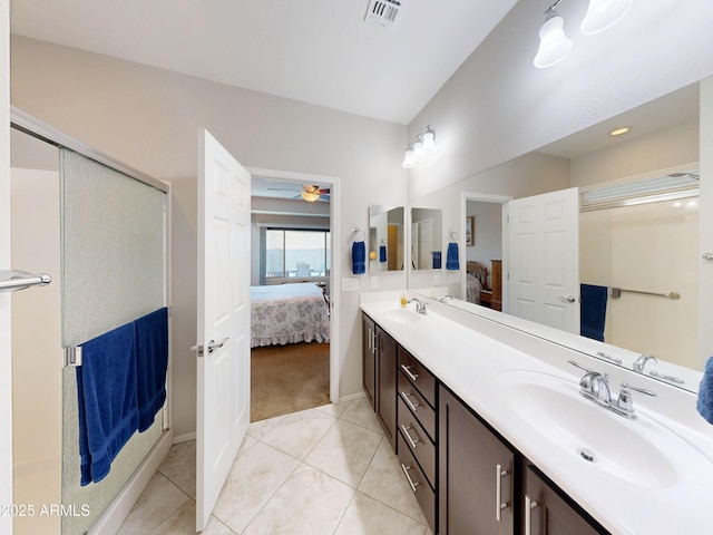 17547 W Gambit Trl, Surprise, AZ 85387 - bathroom featuring ensuite bath, double vanity, tile patterned floors, a stall shower, and ceiling fan
