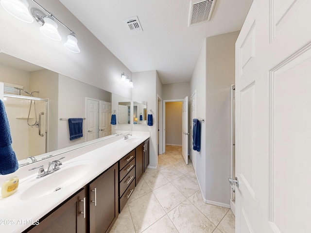 17547 W Gambit Trl, Surprise, AZ 85387 - full bathroom featuring double vanity, a stall shower, and baseboards