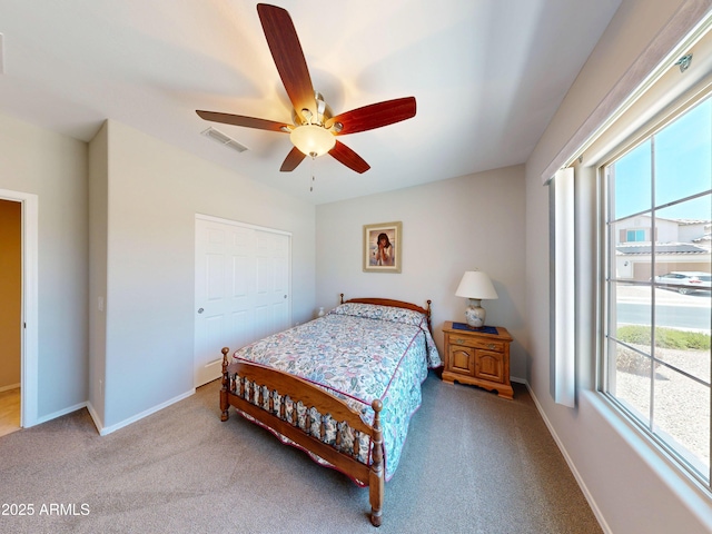 17547 W Gambit Trl, Surprise, AZ 85387 - carpeted bedroom featuring multiple windows, baseboards, and a ceiling fan