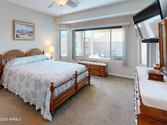 17547 W Gambit Trl, Surprise, AZ 85387 - bedroom with carpet flooring, multiple windows, baseboards, and a ceiling fan