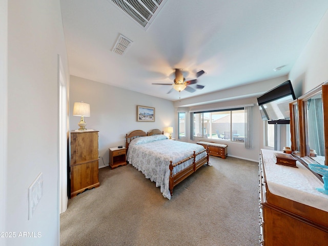 17547 W Gambit Trl, Surprise, AZ 85387 - bedroom with light carpet, ceiling fan, and baseboards