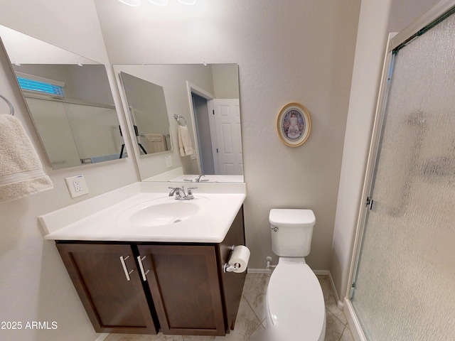 17547 W Gambit Trl, Surprise, AZ 85387 - bathroom with a shower stall, toilet, vanity, and tile patterned flooring