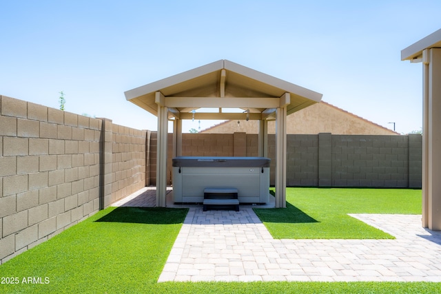 17547 W Gambit Trl, Surprise, AZ 85387 - fenced backyard featuring a hot tub and a patio area