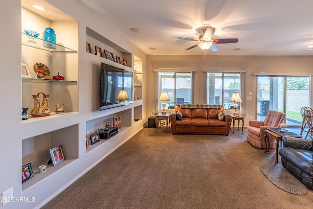 17547 W Gambit Trl, Surprise, AZ 85387 - carpeted living room featuring built in features and ceiling fan