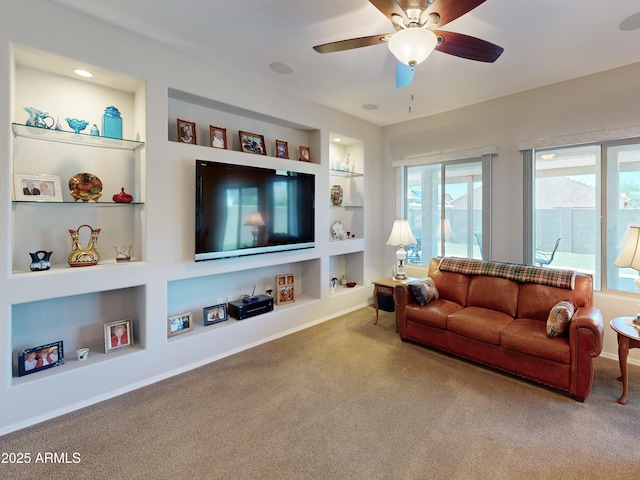 17547 W Gambit Trl, Surprise, AZ 85387 - living area with built in features, carpet flooring, a ceiling fan, and baseboards