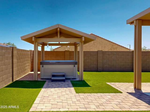 17547 W Gambit Trl, Surprise, AZ 85387 - fenced backyard with a hot tub and a patio area