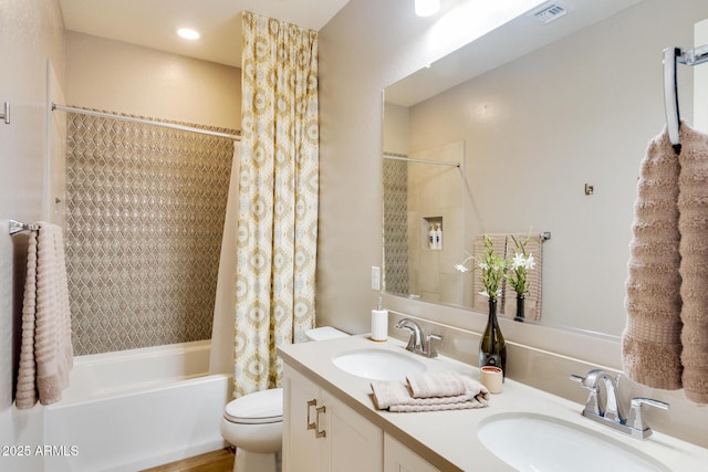 bathroom with toilet, shower / bath combination with curtain, visible vents, and a sink