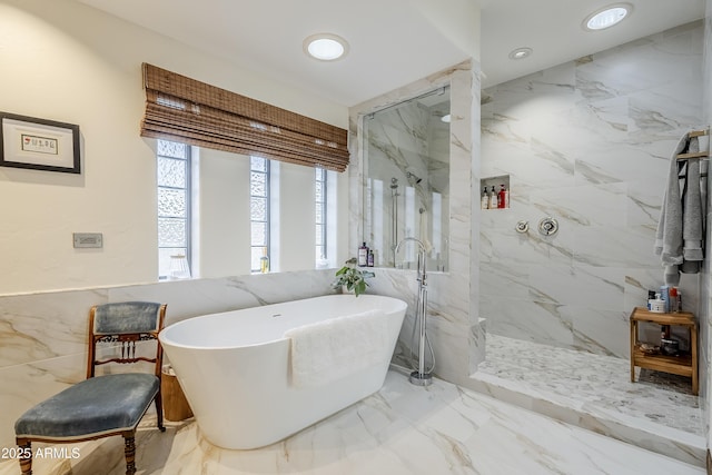 bathroom with marble finish floor, a marble finish shower, a freestanding bath, and recessed lighting