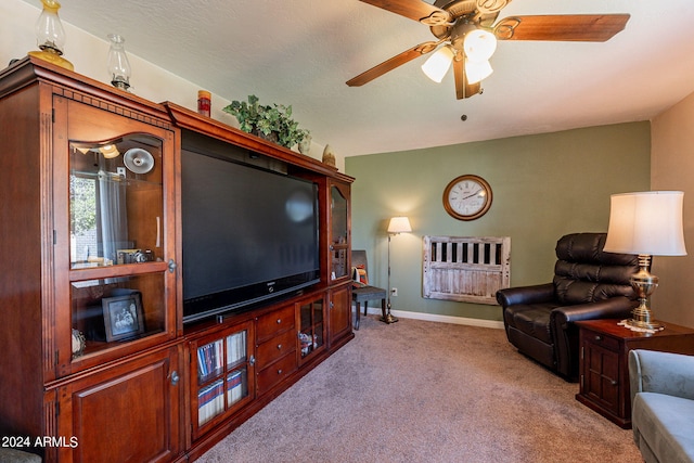 living room featuring vaulted ceiling, ceiling fan, and light colored carpet