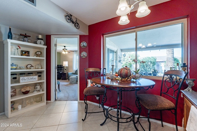 dining space with ceiling fan and light tile patterned floors