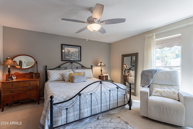 bedroom with ceiling fan and light colored carpet