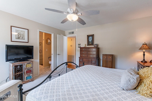 bedroom featuring carpet floors, connected bathroom, and ceiling fan